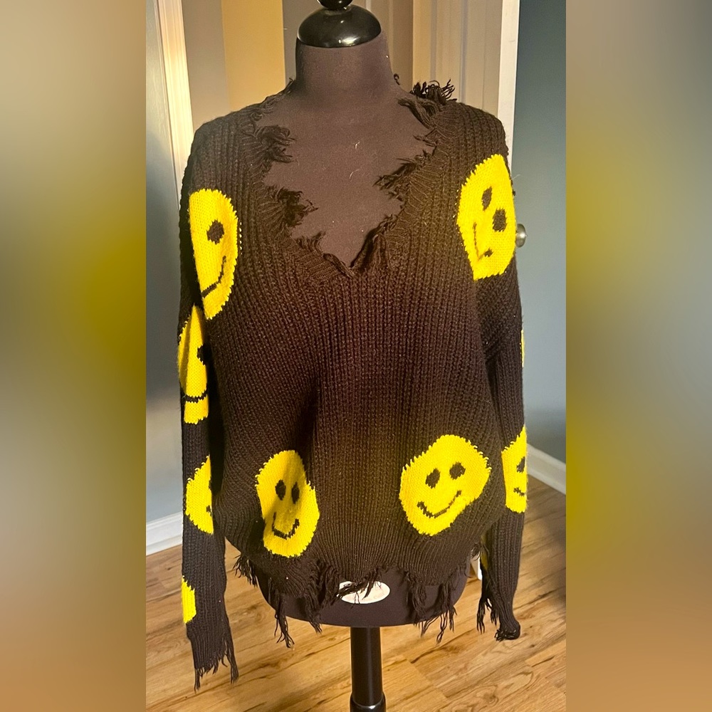 Frayed black emoji sweater